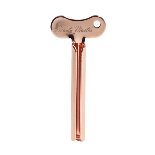 BEAUTY MASTER Metalowa wyciskarka do tubek w kolorze różowego złota